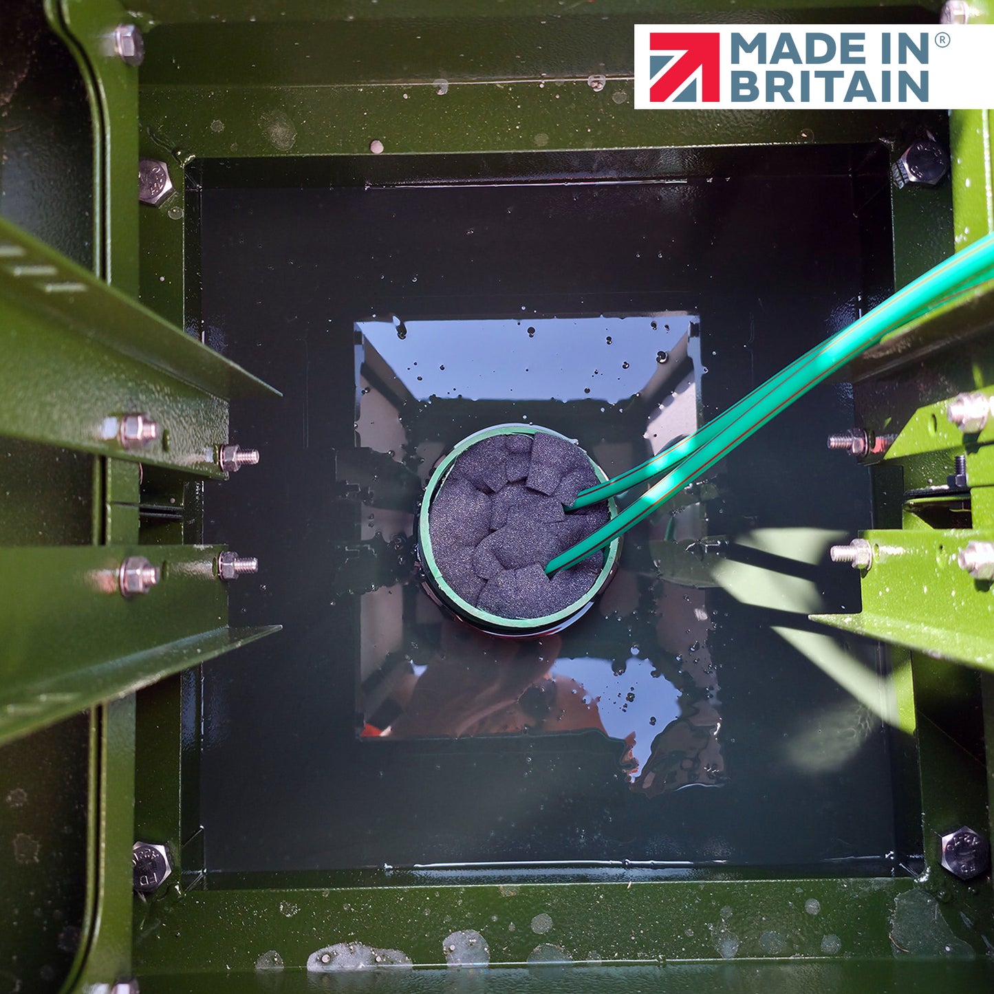 GreenStuff non-hazardous cabinet base sealant used inside a green telecom chamber, sealing cable entries against water and gas ingress, Made in Britain product for underground duct protection.