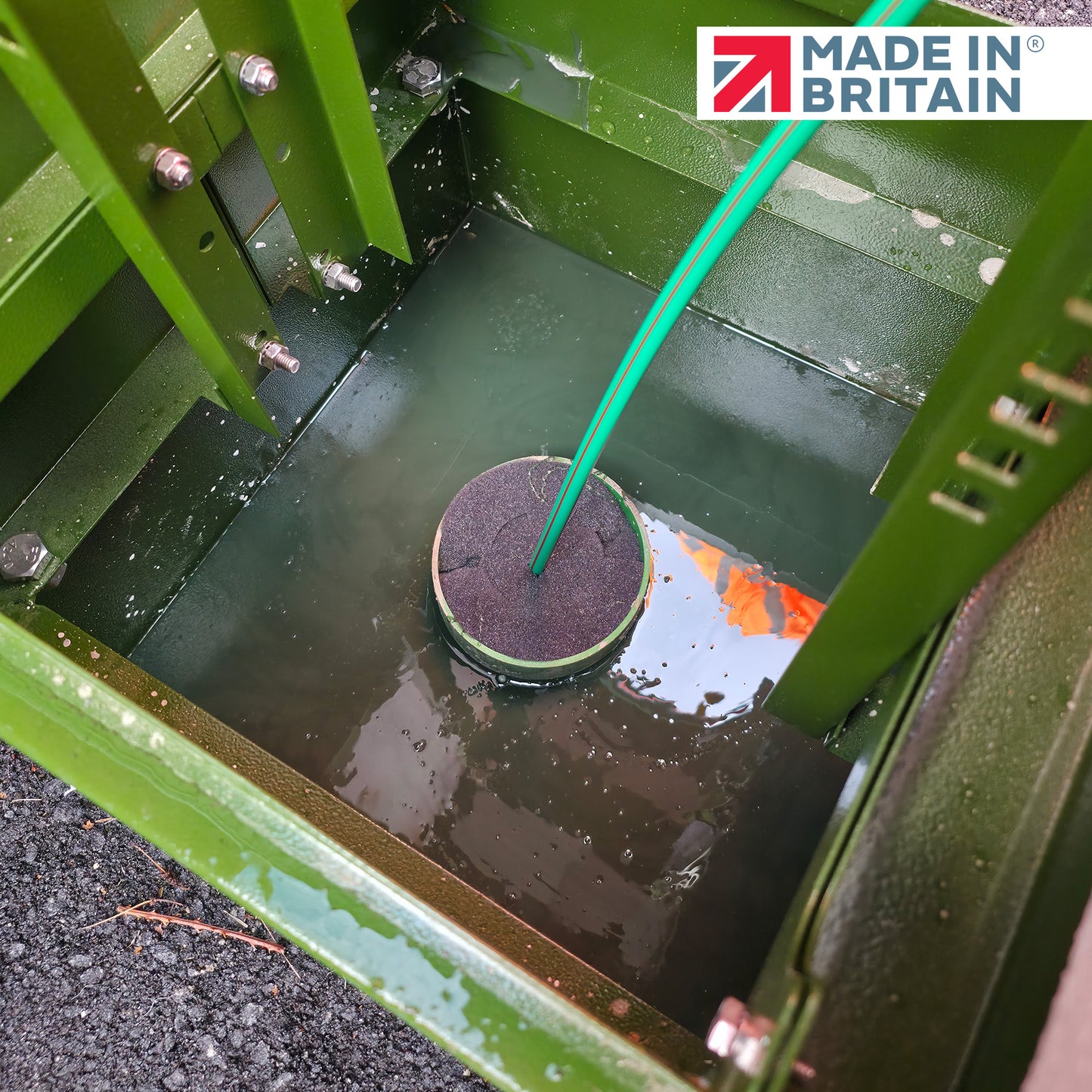 GreenStuff non-hazardous cabinet base sealant securing cable entry in a flooded telecom chamber, Made in Britain, ensuring watertight protection and long-term cable sealing integrity.
