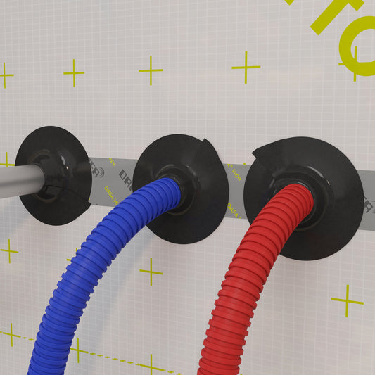 DAFA Renovation Collars installed on a vapour barrier membrane, sealing grey, blue, and red corrugated conduits for airtight cable penetration protection.